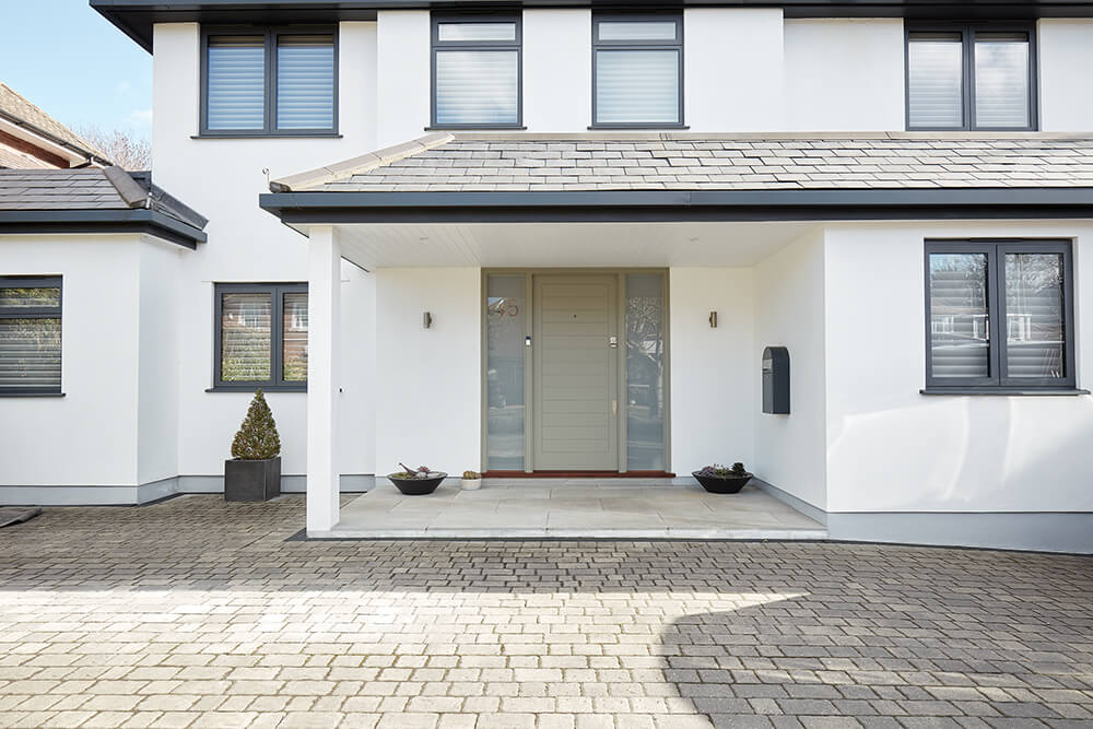 Contemporary home with grey front door. 