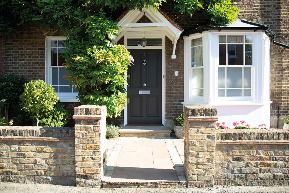 Grey Victorian style front door.