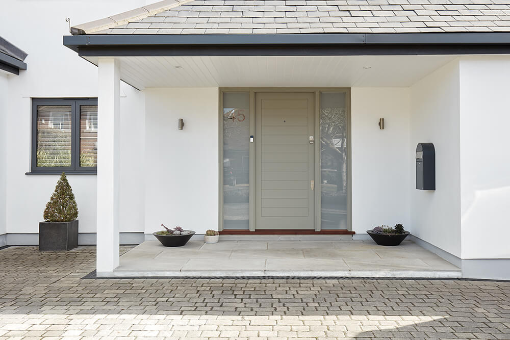 Contemporary grey front door with sidelights