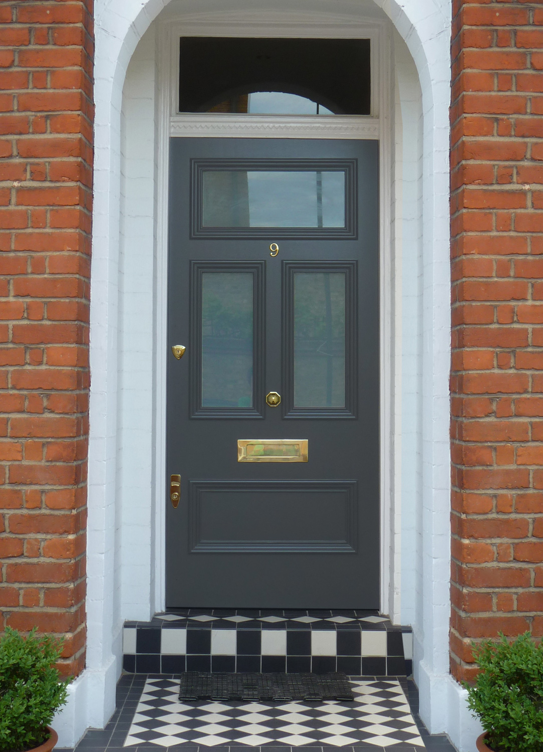 'Lead' Grey Edwardian front door, featuring brass hardware.